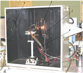 Внешний вид рабочего эталона: 1 - ламподержатель , 2 - образцовая светоизмерительная лампа ТРУ1100 2350, 3 - турель с диафрагмами, 4 - юстировочный рейтер, 5 - непрозрачный охлаждаемый кожух